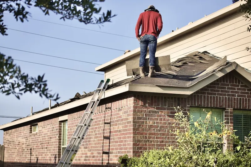 Professional roofer working on a residential roof in San Diego Country Estates